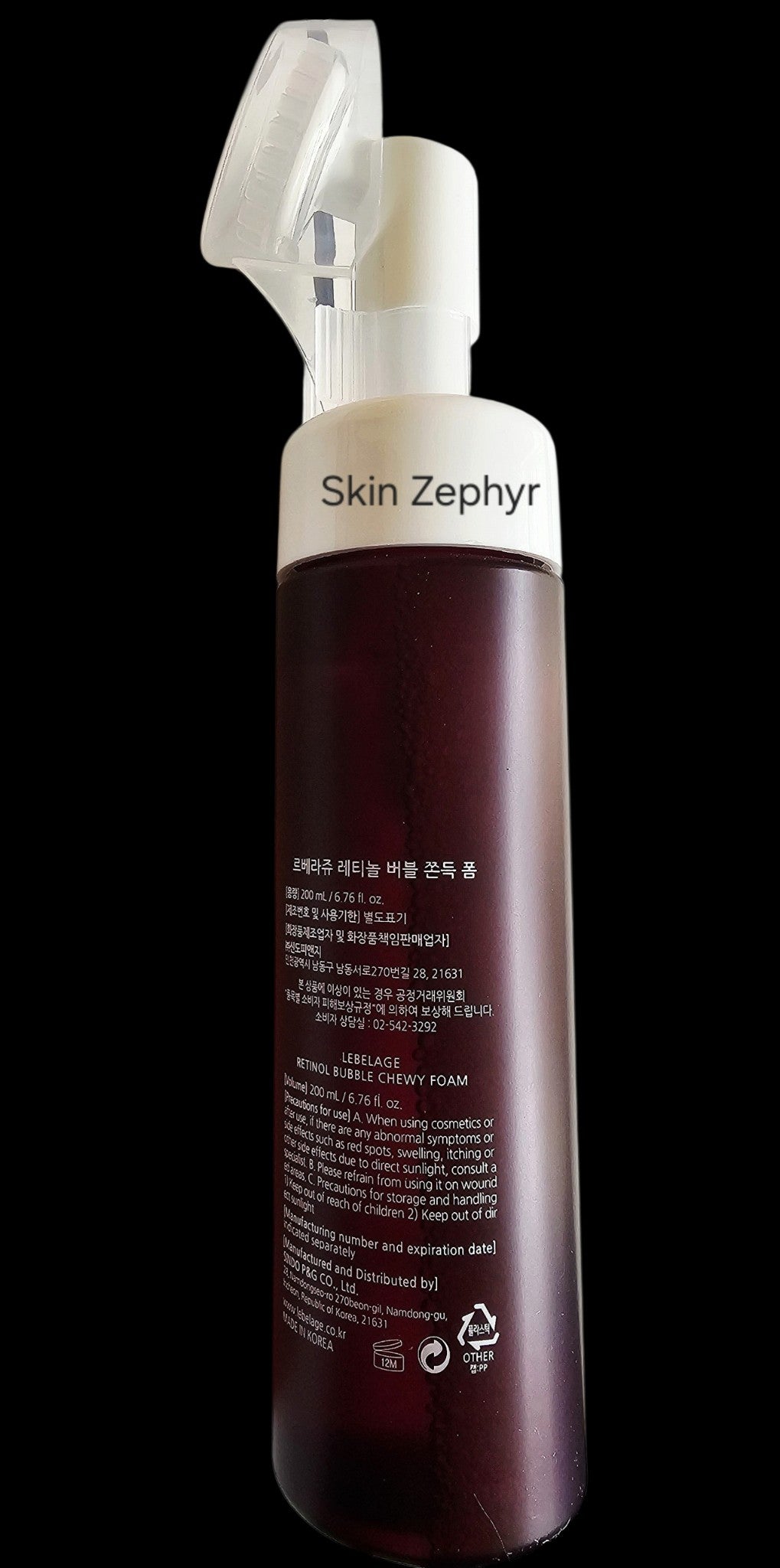 Skin Zephyr Lebelage Retinol Chewy Foam Cleanser bottle with an integrated silicone brush head for facial massage.