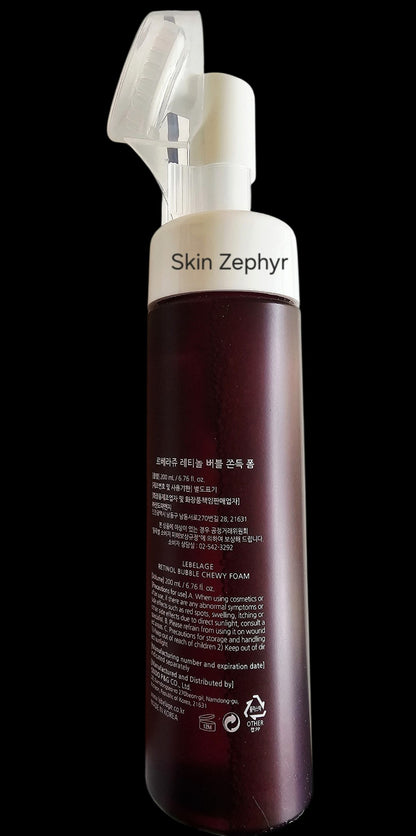 Skin Zephyr Lebelage Retinol Chewy Foam Cleanser bottle with an integrated silicone brush head for facial massage.